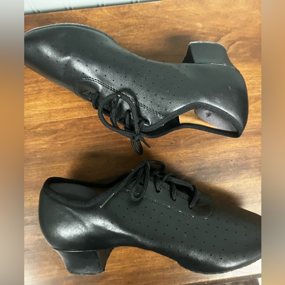 Black dance shoes. Approximately US size 5.5.